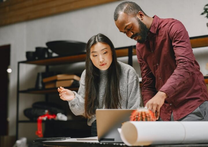 people looking at laptop