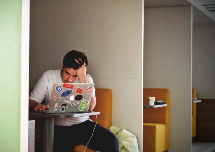 man looking at laptop